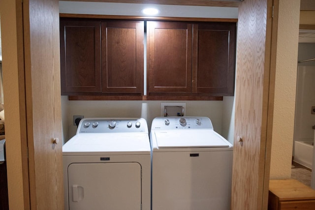 416 Gannon Ct, Tomah, WI 54660 - clothes washing area with cabinet space and washer and clothes dryer
