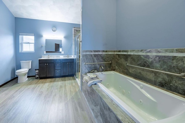 bathroom featuring toilet, a shower with curtain, a sink, and a whirlpool tub