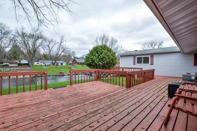 W10940 W Harmony Dr, Lodi, WI 53555 - wooden deck featuring a water view and a yard