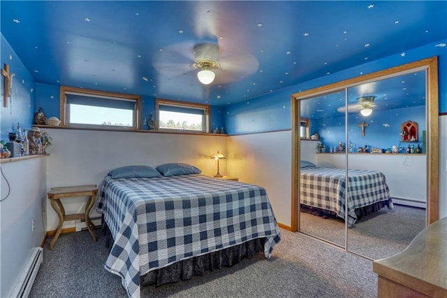 carpeted bedroom featuring a closet, baseboards, and baseboard heating