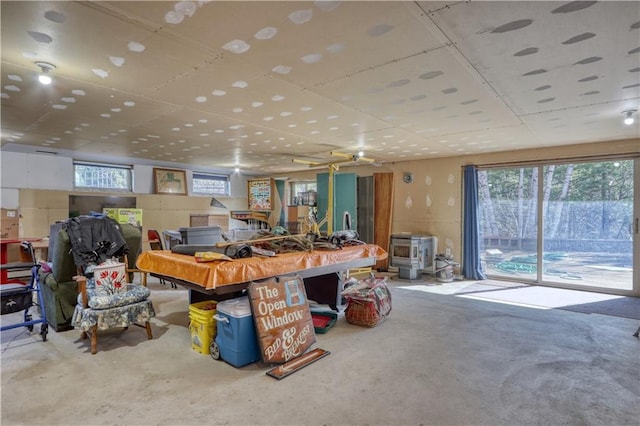 recreation room with concrete flooring