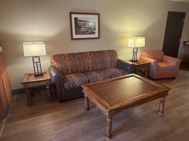 living room featuring baseboards and wood finished floors