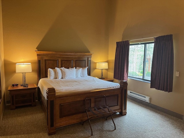 bedroom featuring carpet and a baseboard heating unit