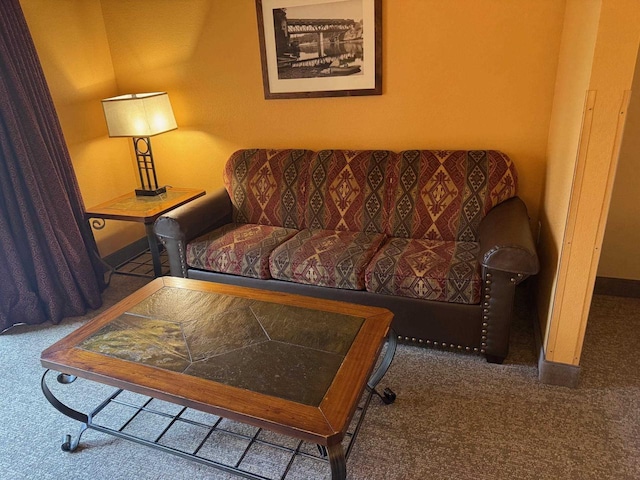 carpeted living room featuring baseboards