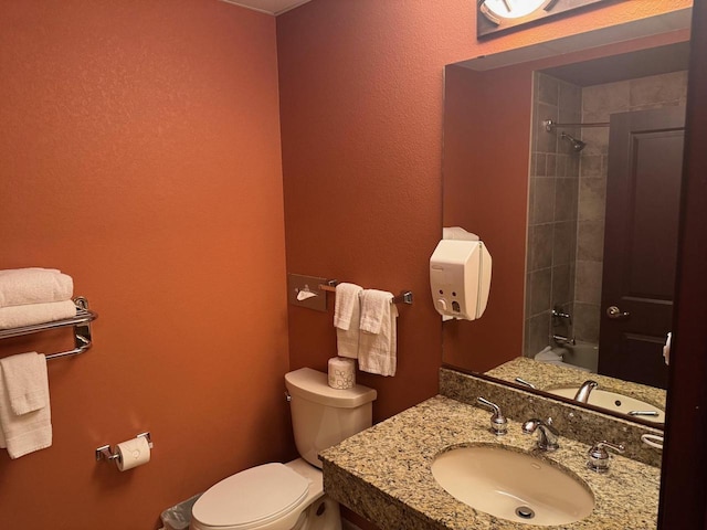 full bath with vanity and toilet