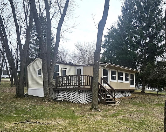 back of house featuring a deck