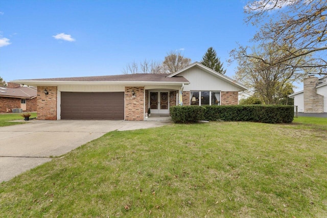 ranch-style home featuring driveway, french doors, a garage, and a front yard