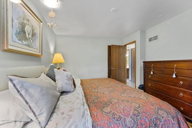 bedroom featuring visible vents