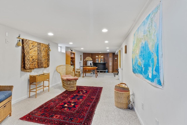 sitting room with baseboards, carpet floors, and recessed lighting