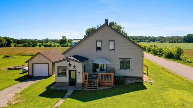 W444 Carlson Ln, Oconto Falls, WI 54154 - view of front facade with driveway, a deck, and a front lawn