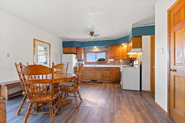 W444 Carlson Ln, Oconto Falls, WI 54154 - dining area with dark wood-style floors, ceiling fan, and baseboards