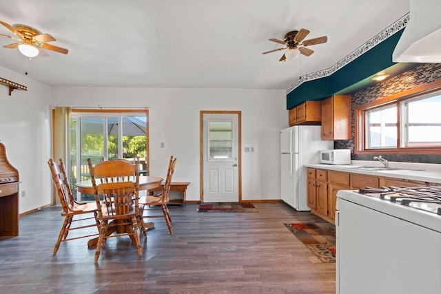 W444 Carlson Ln, Oconto Falls, WI 54154 - kitchen with white appliances, ceiling fan, and plenty of natural light