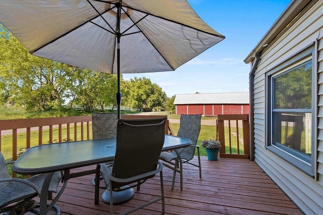 W444 Carlson Ln, Oconto Falls, WI 54154 - wooden deck with outdoor dining space and a yard