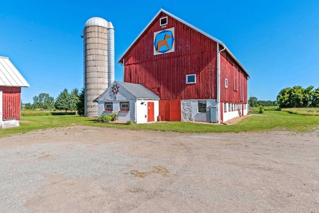 W444 Carlson Ln, Oconto Falls, WI 54154 - view of barn with dirt driveway and a lawn