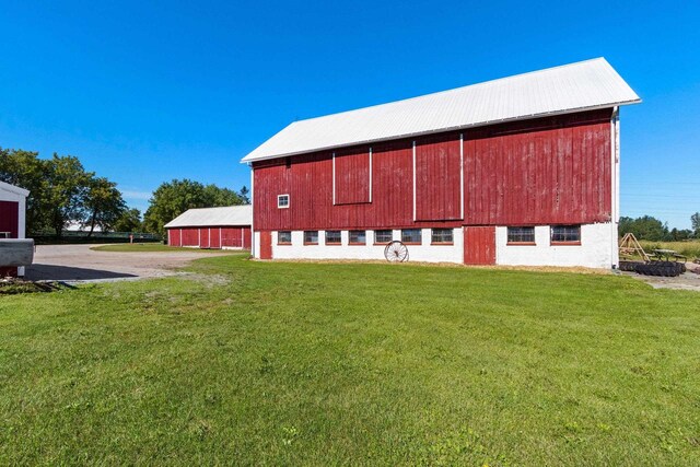 W444 Carlson Ln, Oconto Falls, WI 54154 - view of property featuring a detached garage and driveway