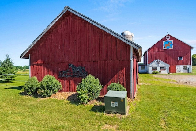 W444 Carlson Ln, Oconto Falls, WI 54154 - view of barn with a lawn