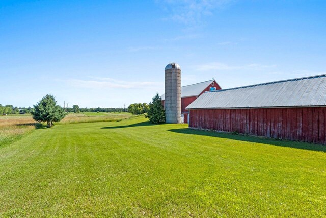 W444 Carlson Ln, Oconto Falls, WI 54154 - view of green lawn with an outdoor structure and a pole building