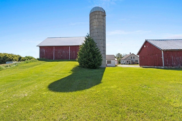 W444 Carlson Ln, Oconto Falls, WI 54154 - view of green lawn with a pole building and an outbuilding
