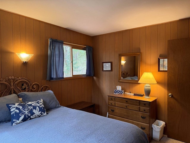 bedroom with wooden walls