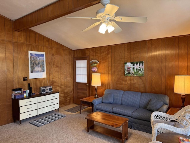 carpeted living room featuring a ceiling fan, lofted ceiling with beams, and wood walls