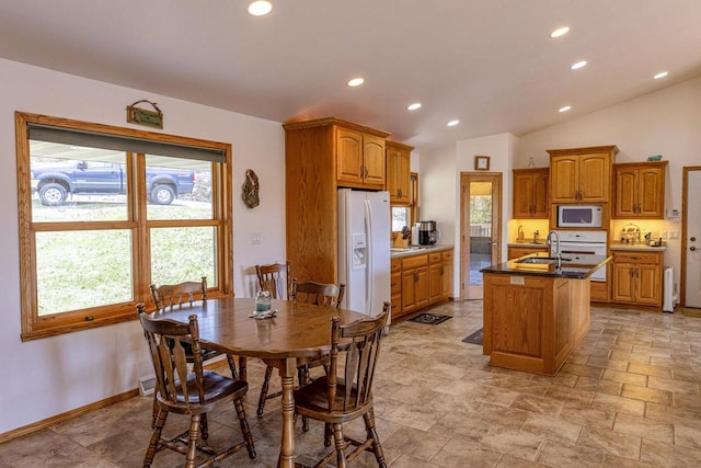 6258 Ninebark Rd, Abrams, WI 54153 - dining area featuring recessed lighting, vaulted ceiling, light stone finish floors, and baseboards