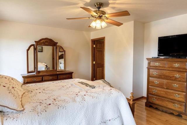 6258 Ninebark Rd, Abrams, WI 54153 - bedroom with wood finished floors, a ceiling fan, and baseboards