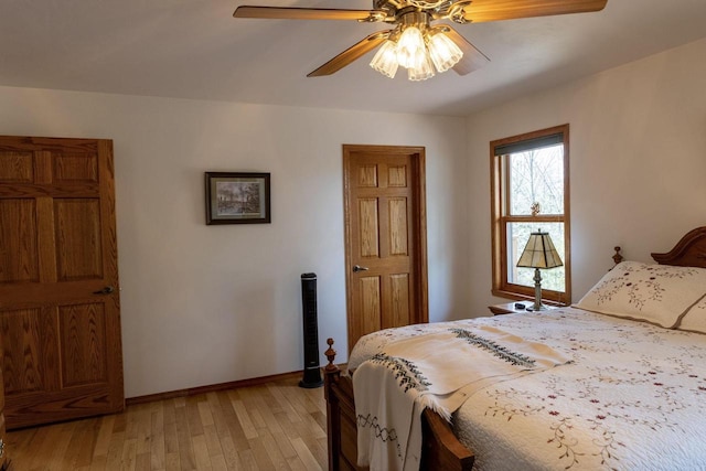 6258 Ninebark Rd, Abrams, WI 54153 - bedroom featuring light wood-style floors, a ceiling fan, and baseboards