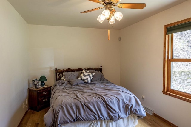 6258 Ninebark Rd, Abrams, WI 54153 - bedroom with wood finished floors, baseboards, and ceiling fan