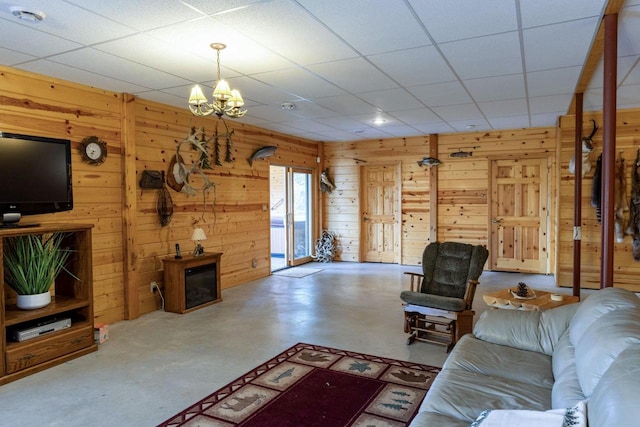 6258 Ninebark Rd, Abrams, WI 54153 - living room with wood walls, a chandelier, and finished concrete flooring