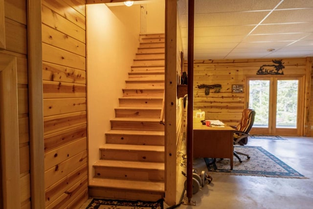 6258 Ninebark Rd, Abrams, WI 54153 - staircase featuring wooden walls and concrete flooring