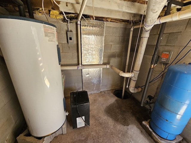 utility room featuring water heater