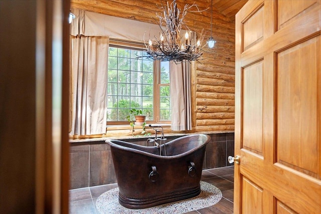 W2470 County Road B, Montello, WI 53949 - full bath featuring log walls, a chandelier, a freestanding tub, tile patterned floors, and wood ceiling