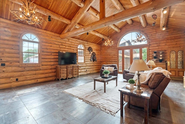 W2470 County Road B, Montello, WI 53949 - living room featuring a chandelier, wood ceiling with exposed beams, plenty of natural light, rustic walls, and high vaulted ceiling