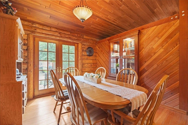 W2470 County Road B, Montello, WI 53949 - dining area with french doors, light wood-style flooring, log walls, and wood ceiling