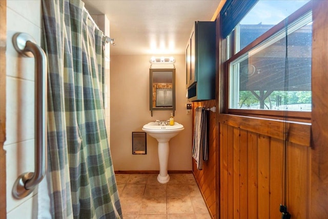 W2470 County Road B, Montello, WI 53949 - bathroom with tile patterned flooring, curtained shower, and a sink