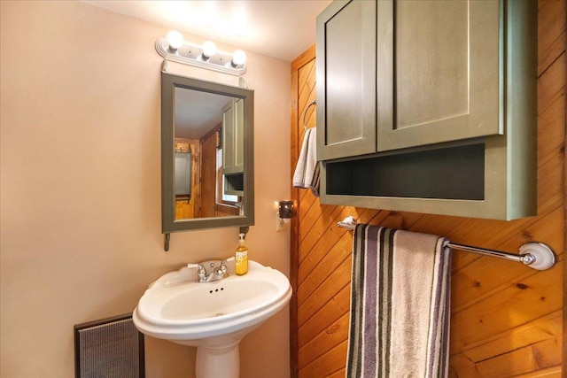W2470 County Road B, Montello, WI 53949 - bathroom with wood walls and a sink