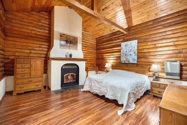 W2470 County Road B, Montello, WI 53949 - bedroom with rustic walls, wood ceiling with exposed beams, wood finished floors, high vaulted ceiling, and a fireplace with flush hearth