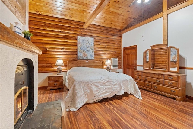 W2470 County Road B, Montello, WI 53949 - bedroom with wooden ceiling, log walls, vaulted ceiling, wood finished floors, and baseboards
