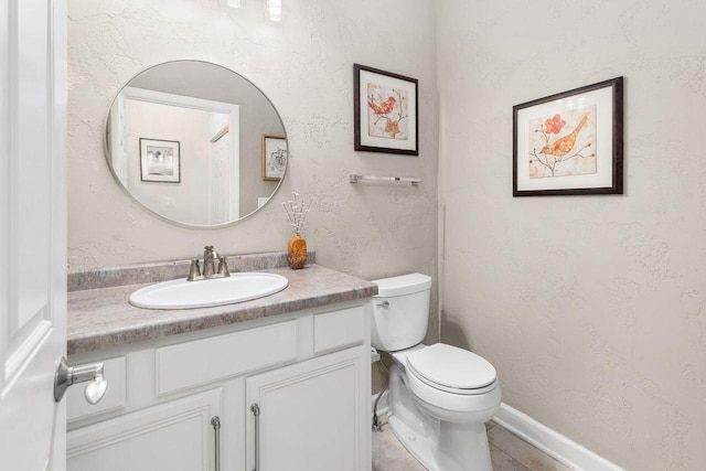 bathroom featuring toilet and vanity