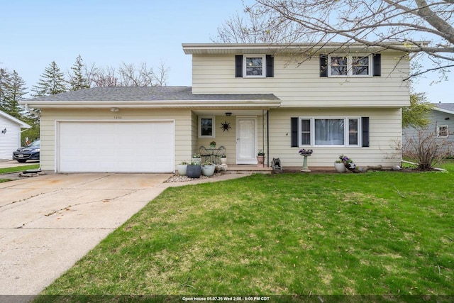 view of front of property with an attached garage, concrete driveway, and a front lawn