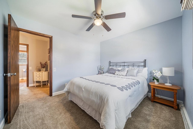 carpeted bedroom with baseboards, a ceiling fan, and a baseboard heating unit