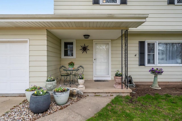 view of exterior entry with covered porch