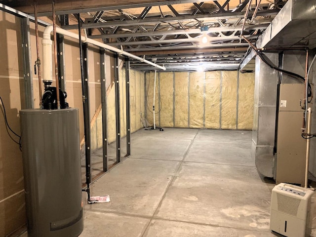 unfinished basement featuring heating unit and water heater