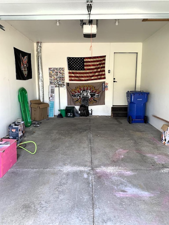 garage featuring a garage door opener