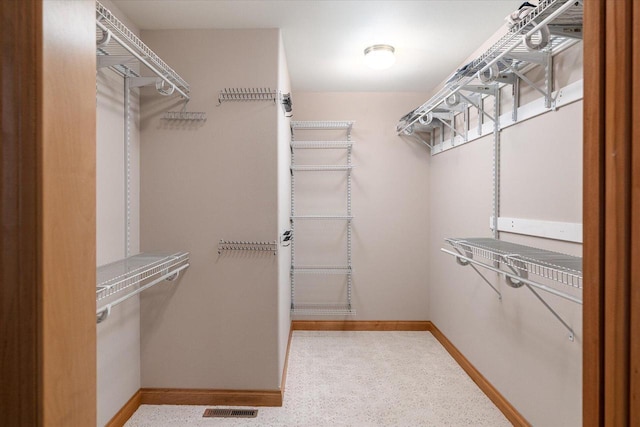 walk in closet with visible vents