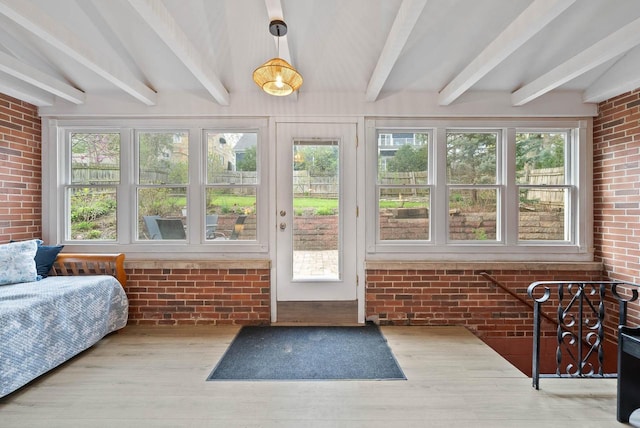 sunroom featuring beamed ceiling
