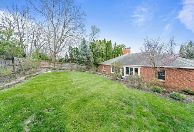 view of yard featuring a fenced backyard
