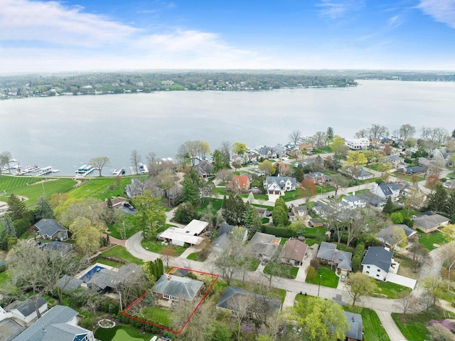aerial view with a water view and a residential view