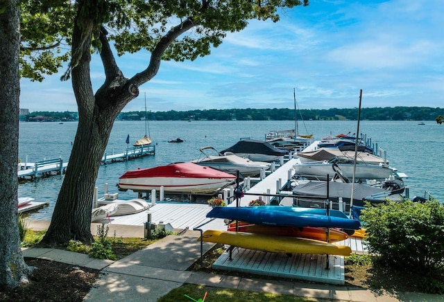 view of dock with boat lift and a water view