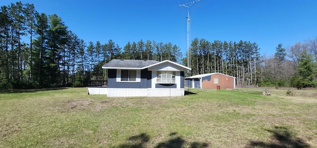 N7120 Sullivan Ln, New Lisbon, WI 53950 - manufactured / mobile home with a front lawn and an outdoor structure